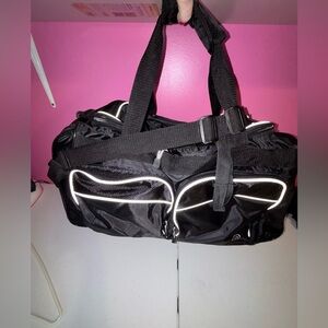 Black Duffel Bag with White Accents and Modern Design